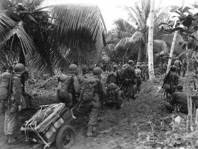 Invasion troops haul supplies ashore at Hollandia