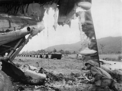 LVTs pass wreck of Japanese plane at Sentani Hollandia