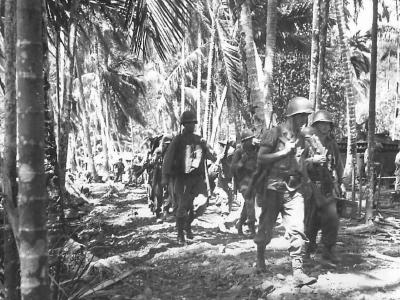 US troops march thru village of Depapre 1944