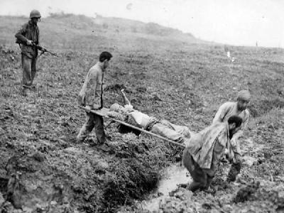 Japanese Soldiers POW Carry Wounded Comrade on Okinawa