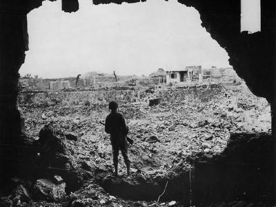 Marine Rifleman Looks over Ruins of Naha Okinawa