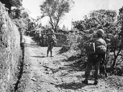 Marines March into Sobe during Invasion of Okinawa