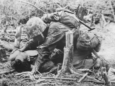 1st Div Marine Gives Water to Wounded Buddy on Peleliu