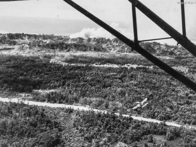 Marine L-4 observing F4U napalm attack