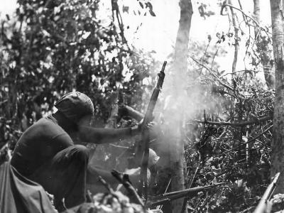 Marine on Suicide Ridge fires rifle grenade from M1 Garand