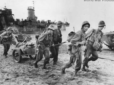 6th Army troops pull mortar ashore on Ormoc Beach