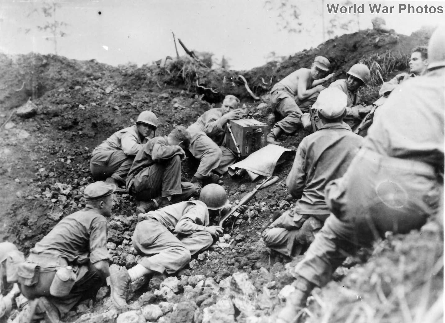GIs in Jolo Bomb crater under heavy machine gun Philippines 45