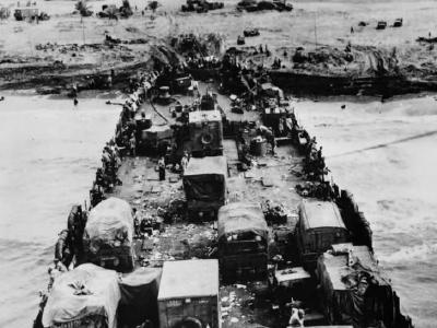 LST unloads trucks and ammunition under fire on Luzon