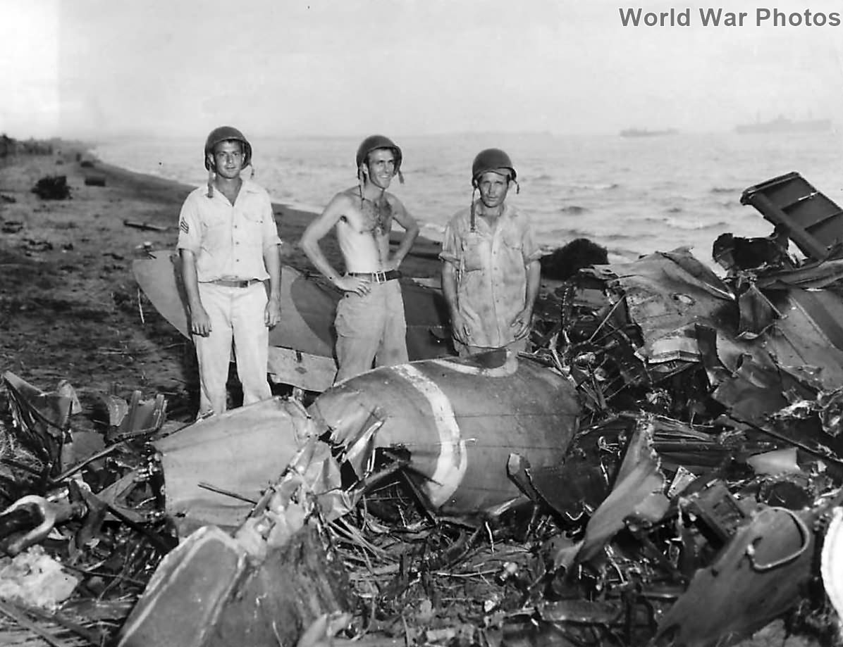 Troops by Japanese plane that fell in their foxhole on Leyte