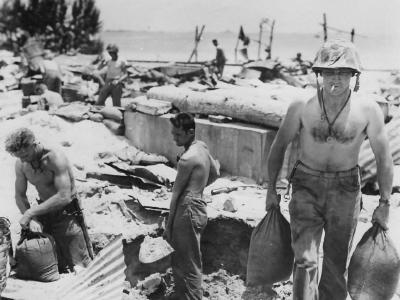 Marine sandbags his foxhole Saipan 1944