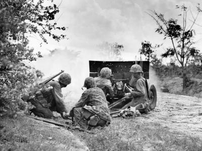 Marines firing 37mm M3 anti tank gun Saipan