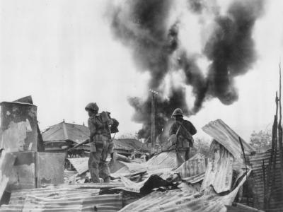Marines seach for snipers, over Garapan Wreckage Saipan