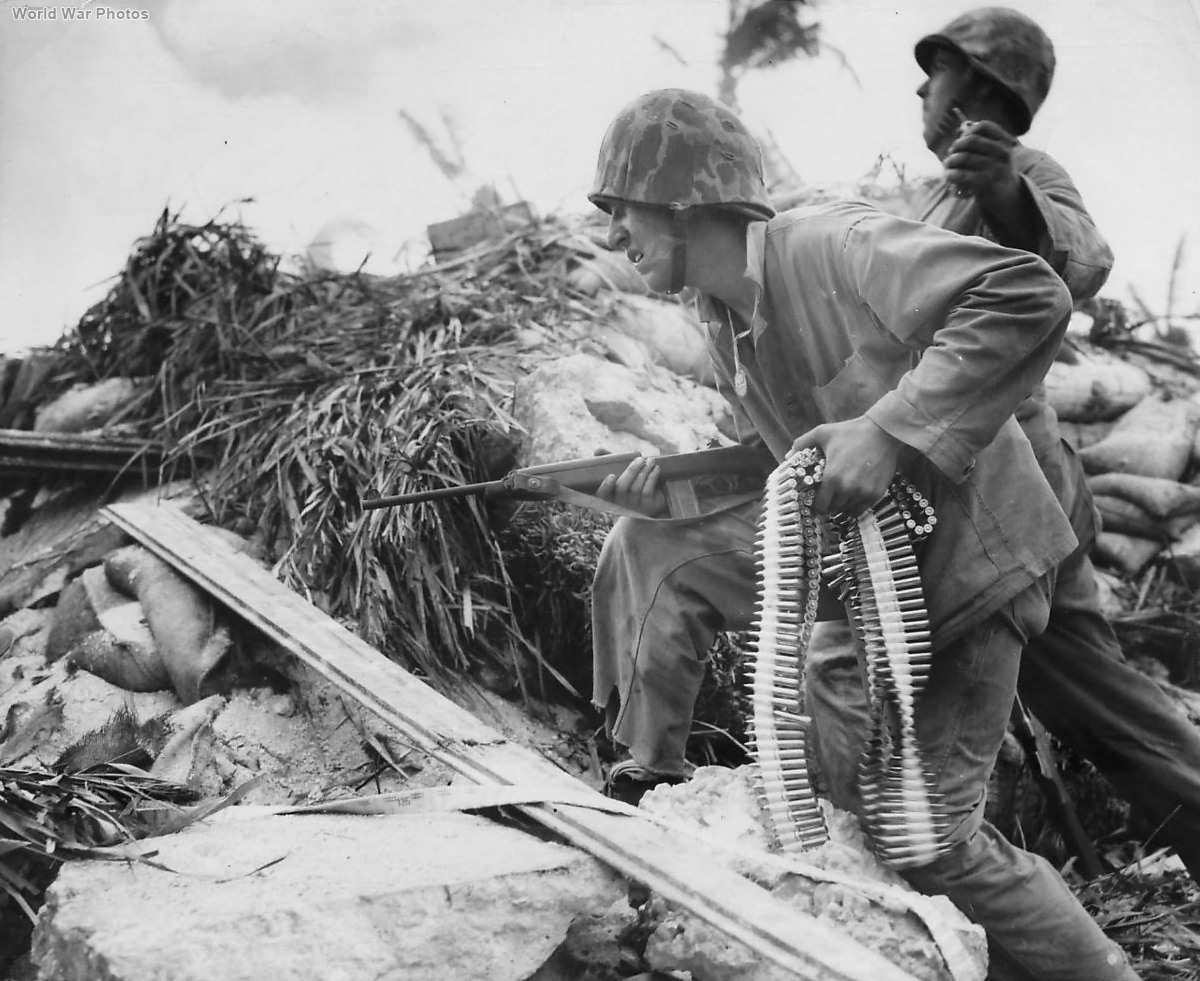 Marine with carbine ready to go over the top on Tarawa
