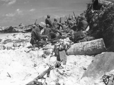 Marines on Red Beach 3 advancing to burns Phillips Pier Tarawa