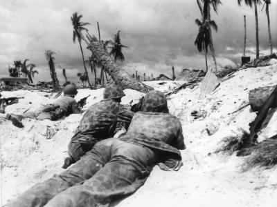 US Marines creep Japanese pill boxes Tarawa Island 1943