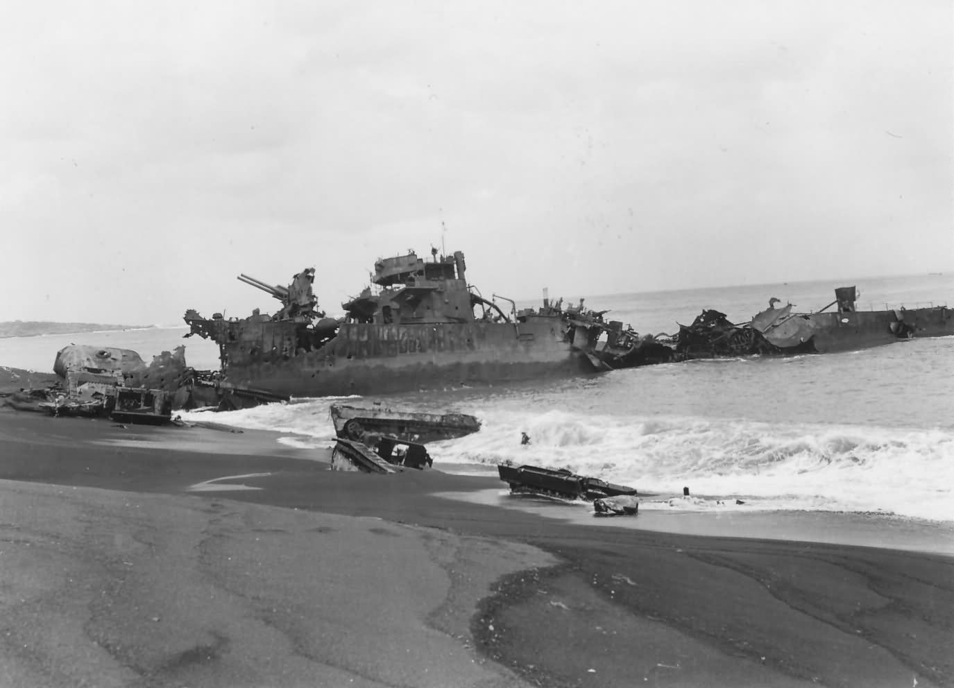 Destroyer and LVT Amtrac Wrecks Landing Craft On Tinian Beach