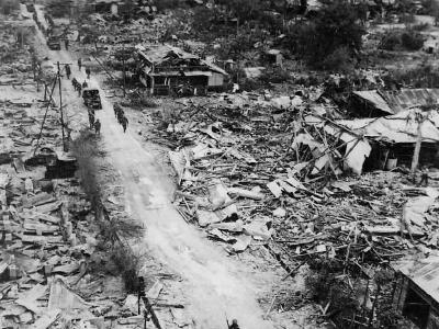 Marines in bombed ruins of Town on Tinian 1944