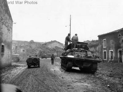 M10 and Jeep entering Fresnes France 1944