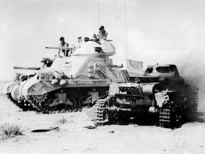 British M3 Grant tank of the 1st Armoured Division and burning Panzer I North Africa
