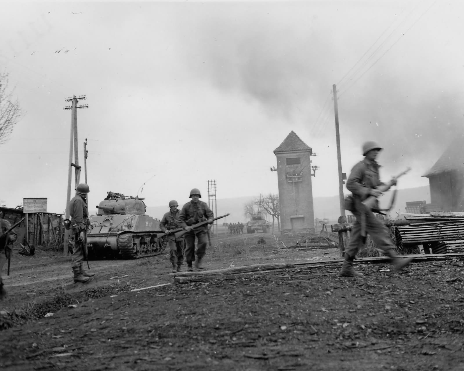 12th Armored Division M4 Sherman and Soldiers Advance into Krautosheim Germany 45