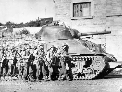 M4 Sherman tank of the 746th Tank Battalion supports Company I, 60th Infantry Regiment, 9th Infantry Division.