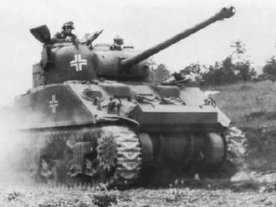 German M4 Sherman VC Firefly moving along a field road