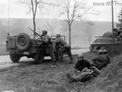 3rd AD medic treats wounded under fire Korbach Germany 5 March 1945