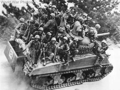 Grinning 29th Division Marines riding atop M4 on Okinawa