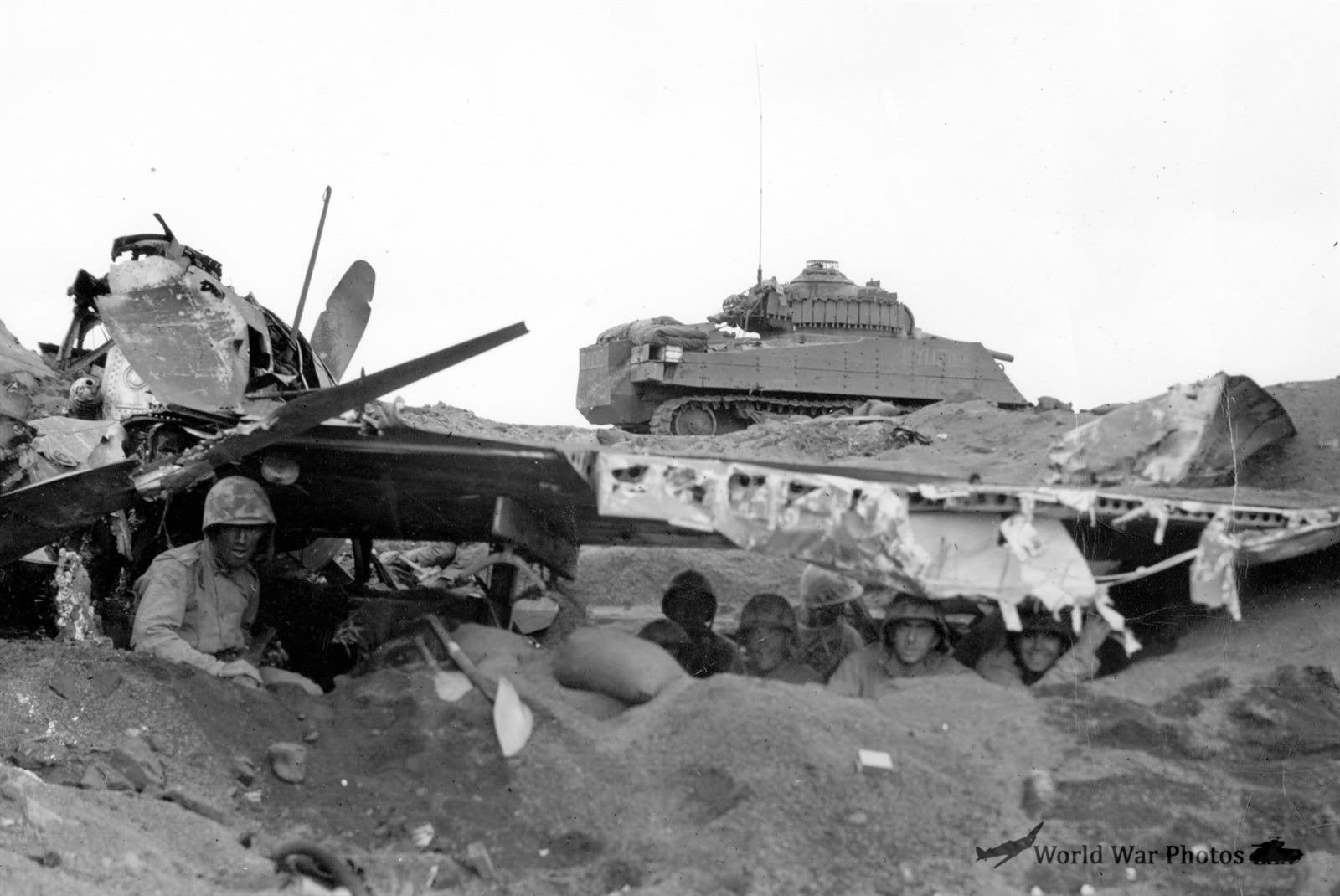 Marines in cover under Japanese Aircraft Wreck on Iwo Jima 1945 m4