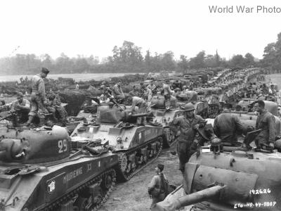 Shermans of 12e regiment de chasseurs d’Afrique (RCA) in concentration after coming ashore in Normandy August 1944