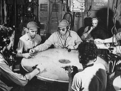 Troops plotting in radar room aboard an Essex class aircraft carrier 1944
