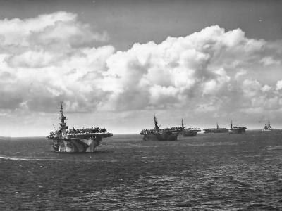 US Navy Escort Carriers and Cruiser at Forward Pacific Base 1945
