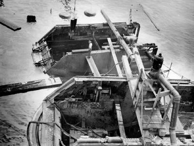 USS Arizona removing projectiles from turret