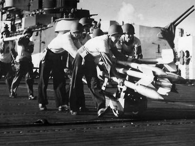 Crewmen on USS Hancock move rockets to planes for strike on Formasa 1944