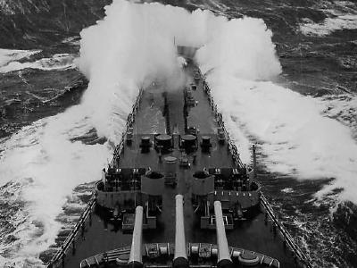 USS Iowa breaks through heavy seas