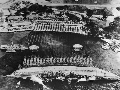Crew work in Pearl Harbor to right the battleship USS Oklahoma 1943