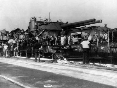 Sailors aboard raised USS Oklahoma in dry dock at Pearl Harbor 1944