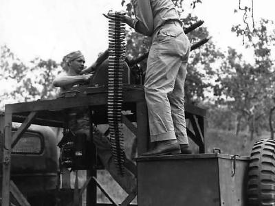 Troops in Chevrolet G506 E-5 turret training truck in New Guinea