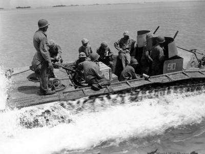 LVT-2 pulls away from LCM with rations headed for the frontlines Saipan