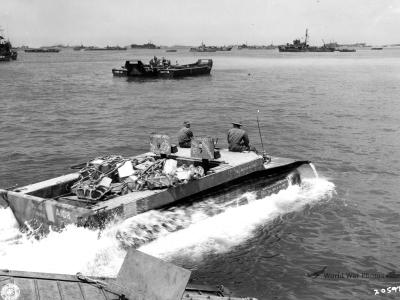 LVT-4 loaded with supplies removed from an LSVP heads for the beach of Okinawa