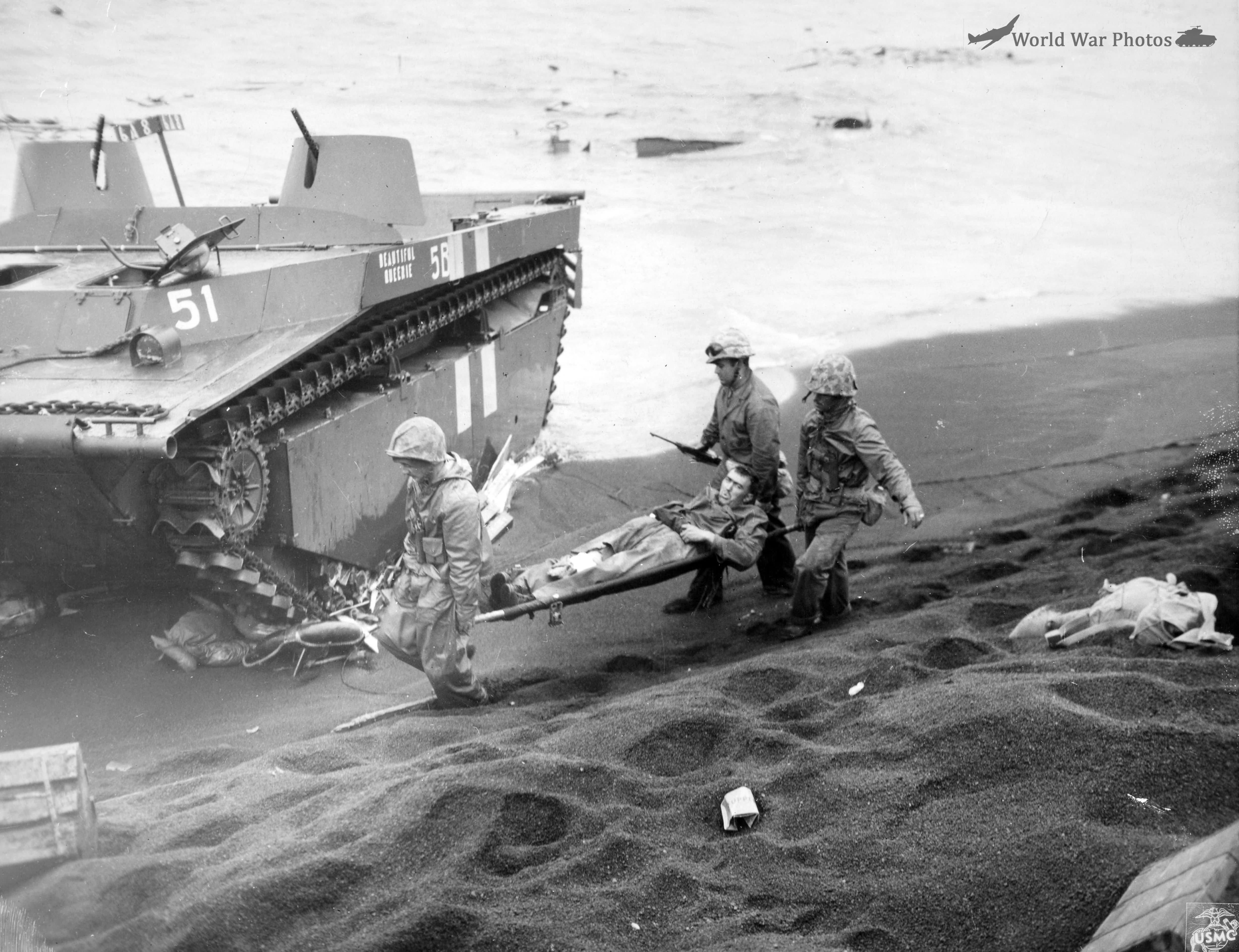 Marines carry a wounded comrade to an evacuation point on Iwo Jima beachhead