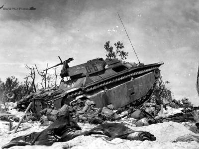 Marines sit by amphibious tractor LVT-4