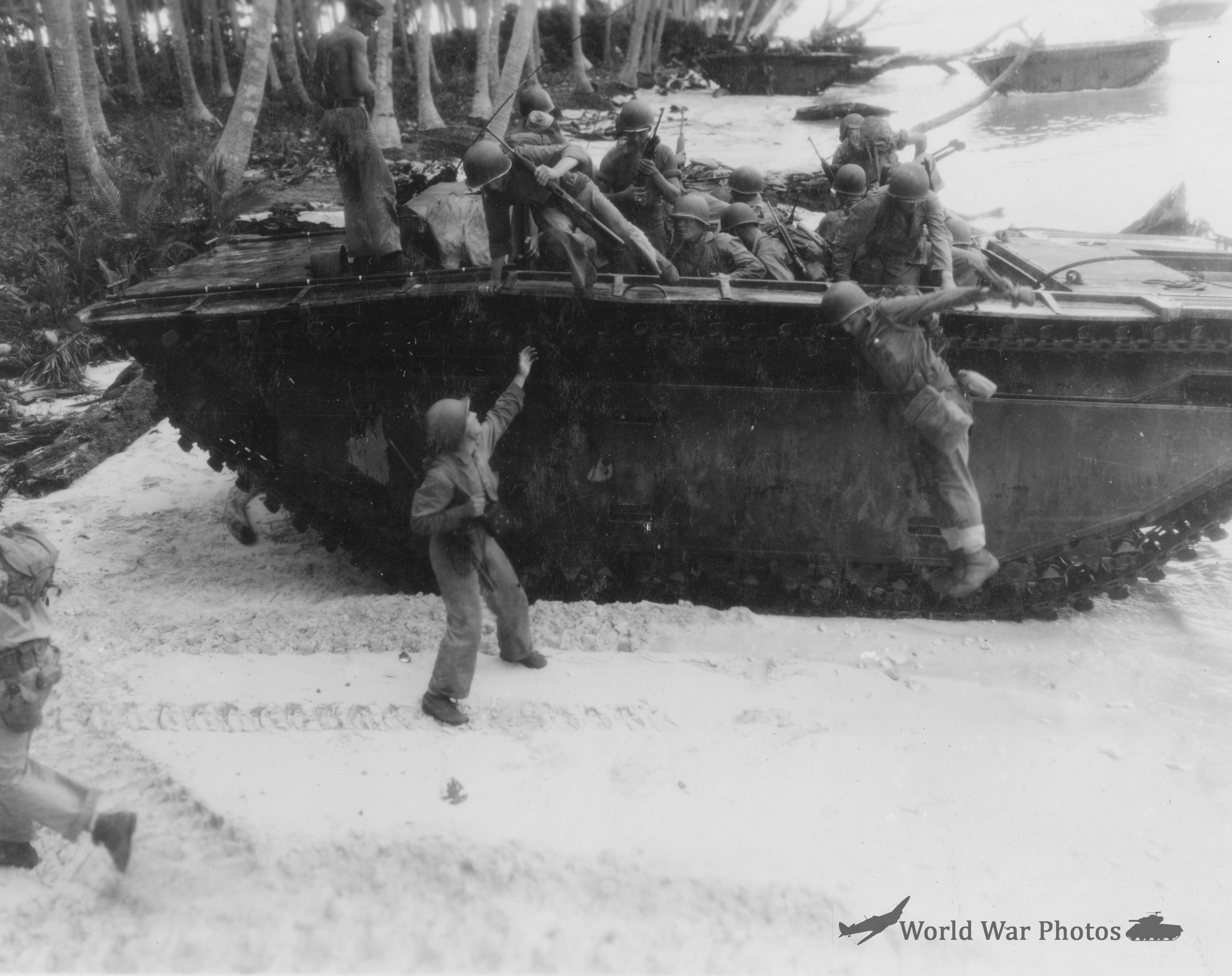 Quickly disembarking from tractor attacking inland 10 March 1944
