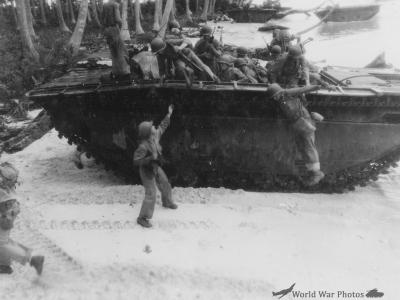 Quickly disembarking from tractor attacking inland 10 March 1944
