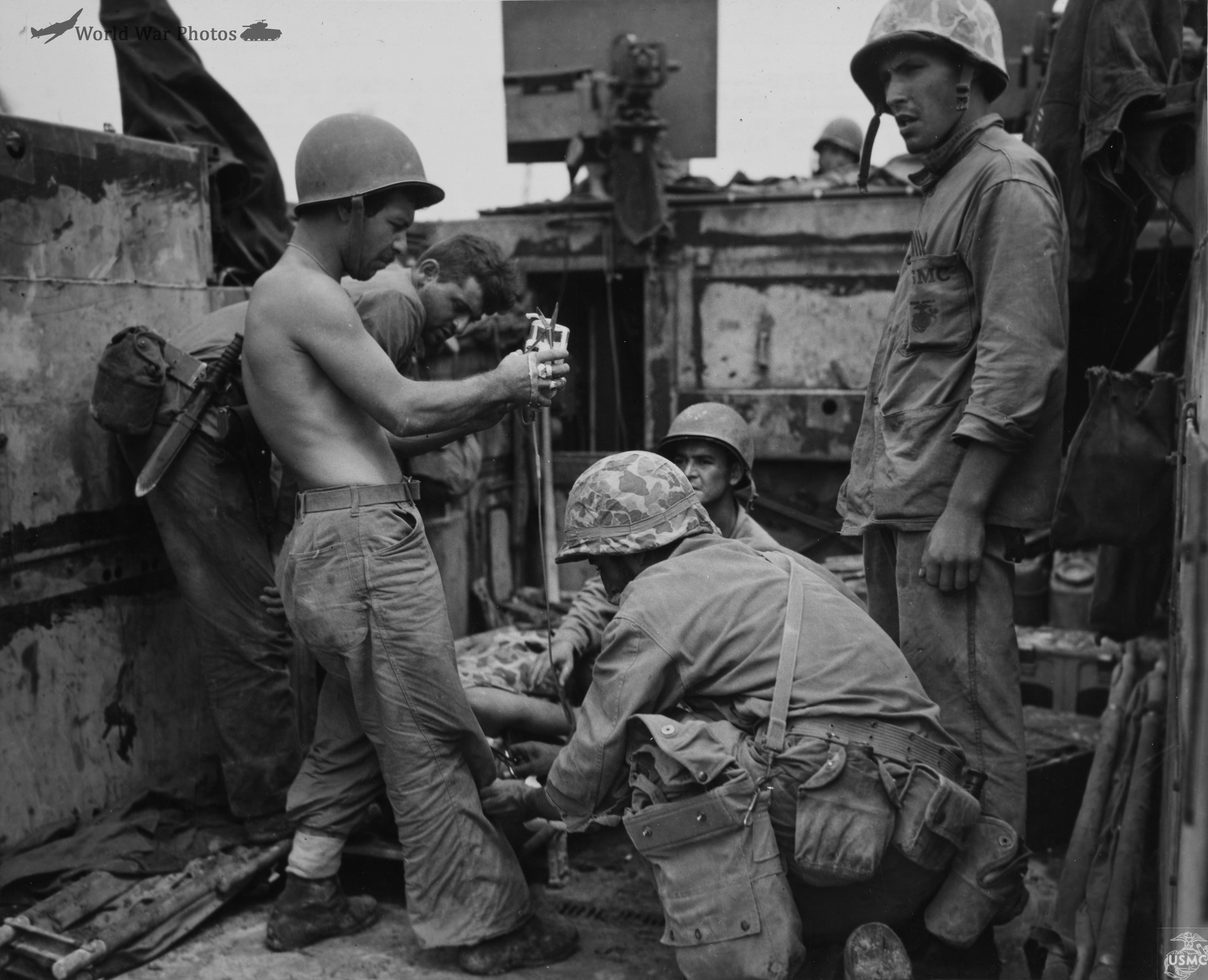 Wounded Marine receives treatment aboard an LVT at Peleliu