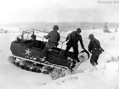 M29 from 99th Infantry Division laying commo wire. France 5 January 1945