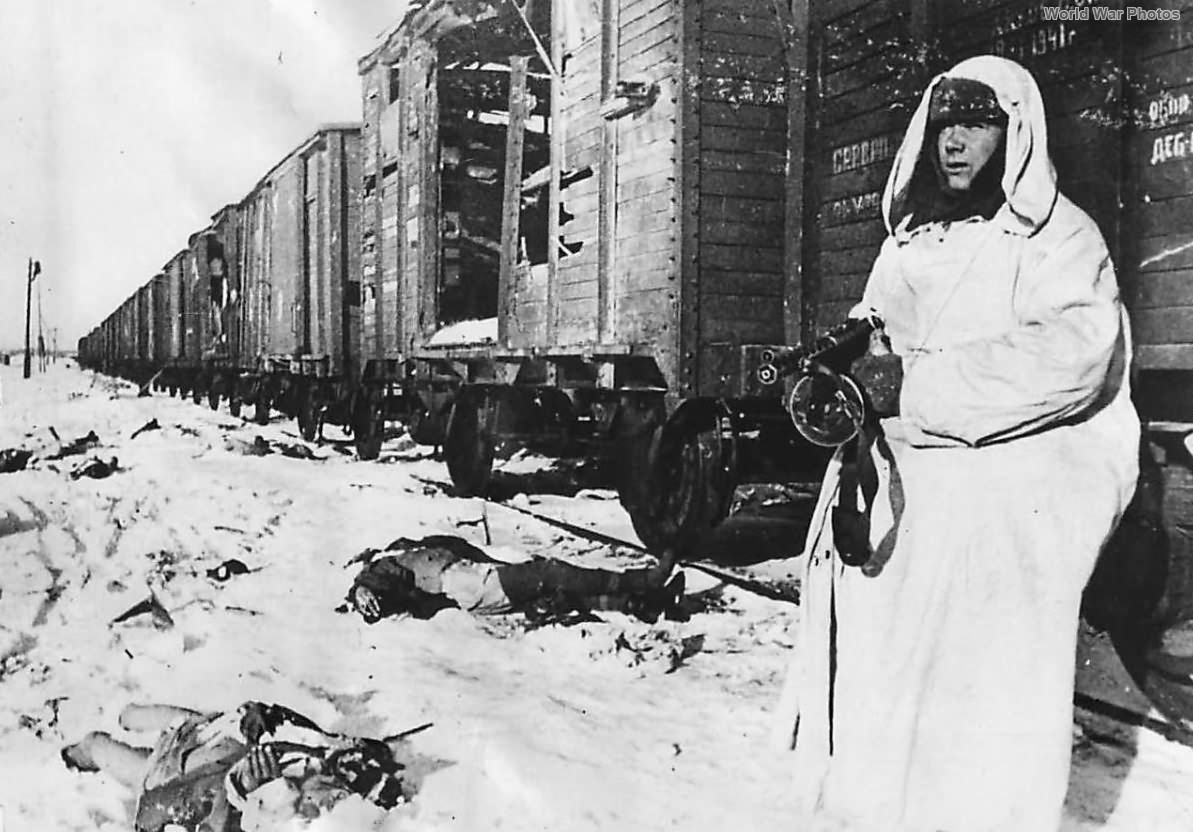 Soviet soldier stands guard among fallen Nazi troops 42