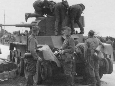 Soviet tank BT-7 and wehrmacht soldiers