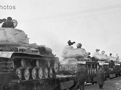 IS-2 tanks loaded onto a flatbed railway cars