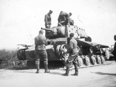 German soldiers examining destroyed KV-1 tank with extra armor
